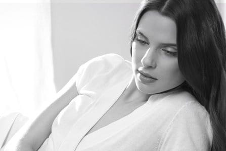 Woman with dark hair in a relaxed pose