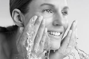 Woman washing her face