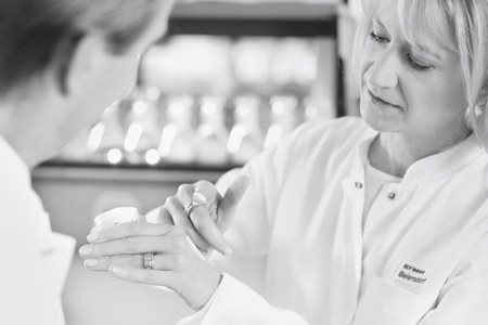 Two scientists testing cream