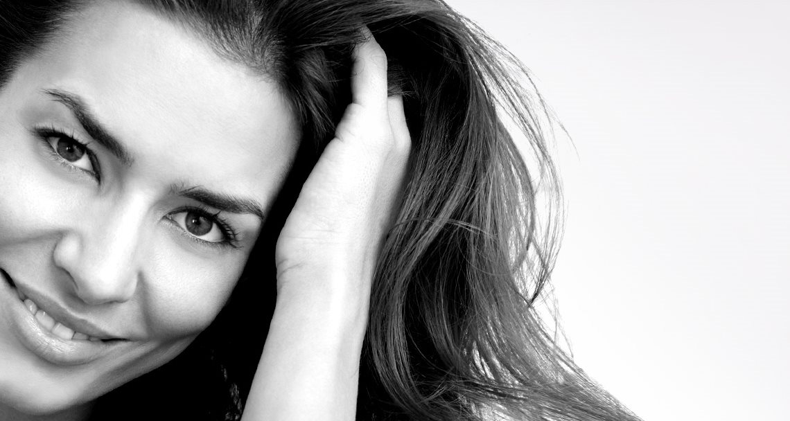 Middle-aged woman´s face with long dark hair