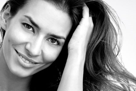 Middle-aged woman´s face with long dark hair