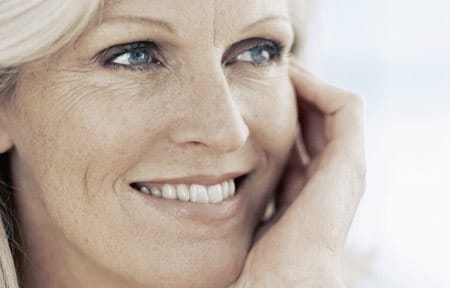 Middle-aged woman smiling.