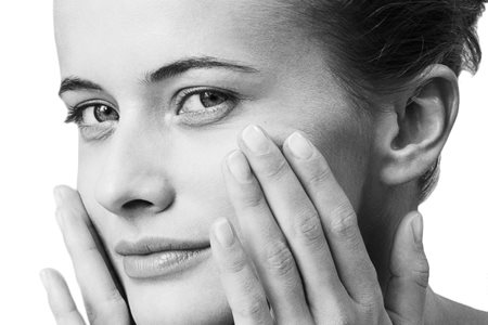 Woman with sensitive facial skin looking in the camera.